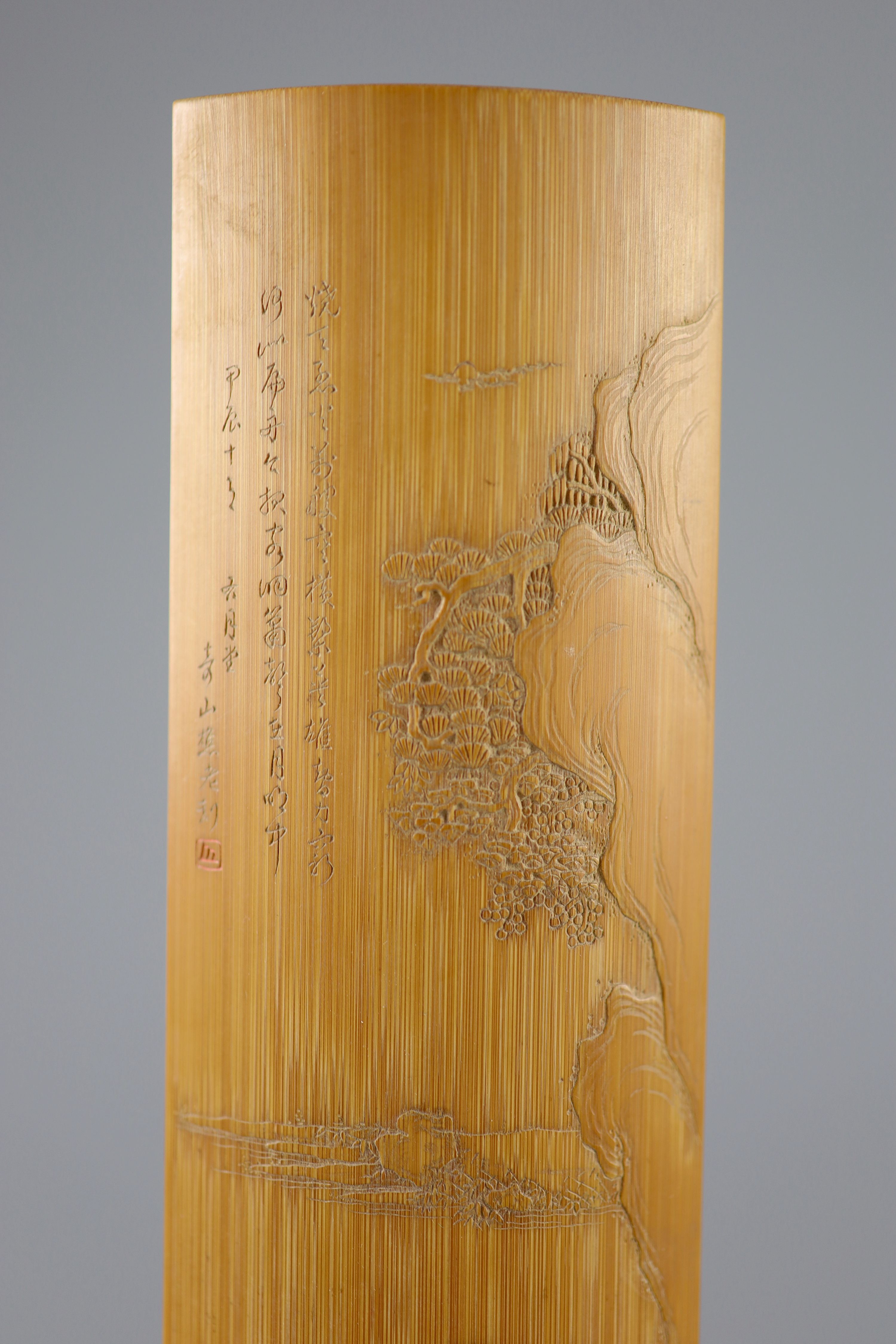 A Chinese carved bamboo wrist rest, Republic period, 22.7 cm long